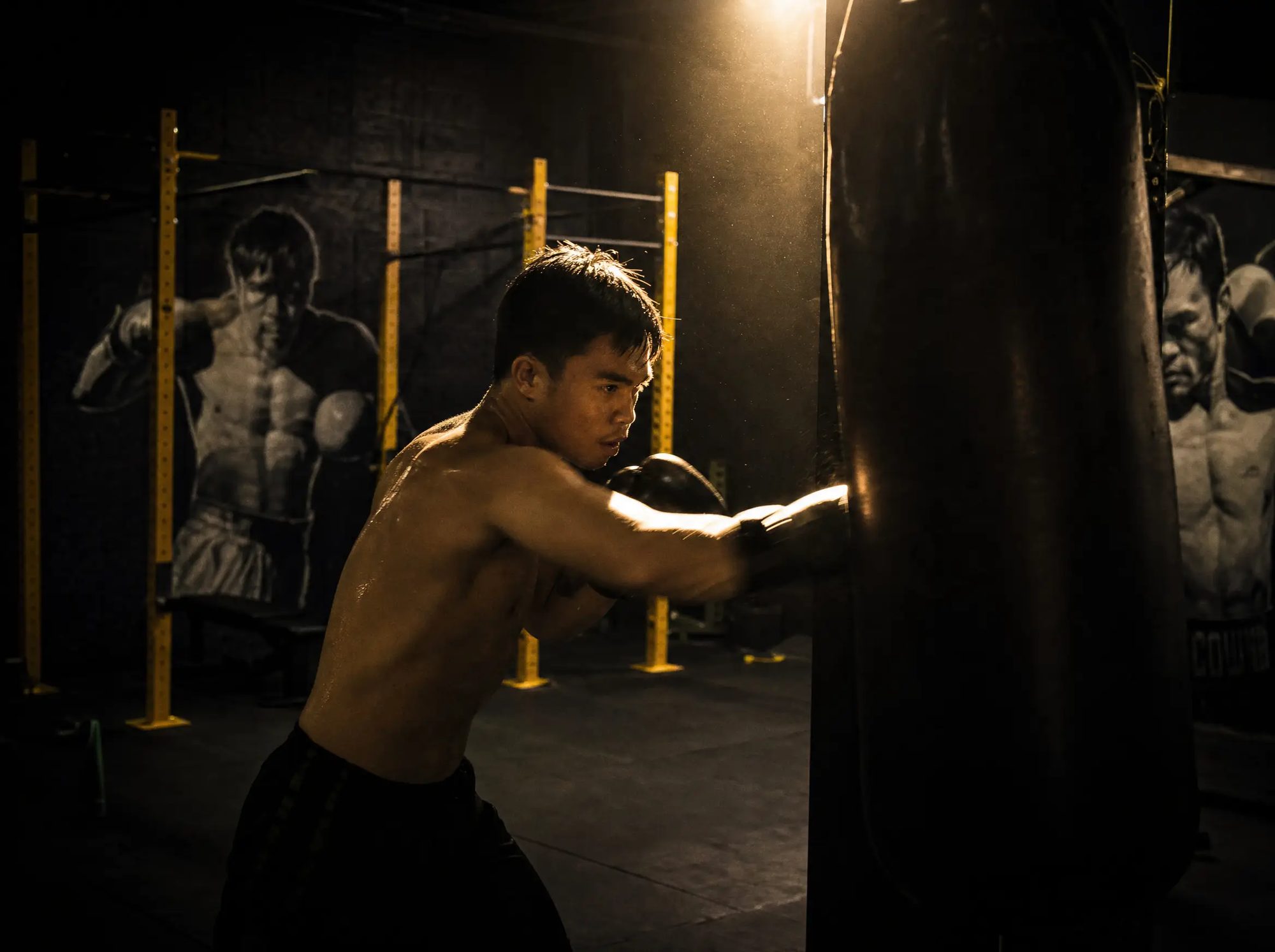 Boxing class working the heavy bags